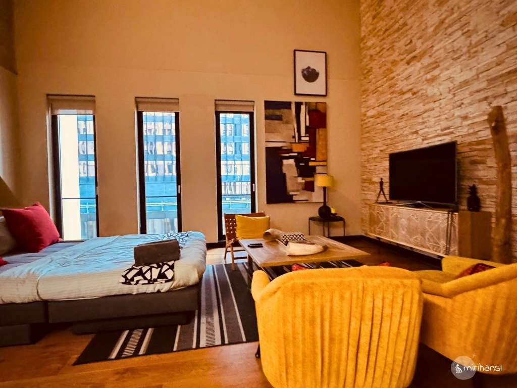 Südafrika - Playful Manhattan Style Loft Kapstadt - Wohnzimmer mit Schlafcouch Südafrika - Playful Manhattan Style Loft Kapstadt - Wohnzimmer mit Schlafcouch